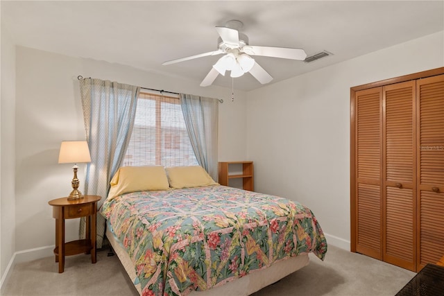 6956 Turtlemound Rd, New Smyrna Beach, FL 32169 - bedroom featuring carpet, a closet, and ceiling fan