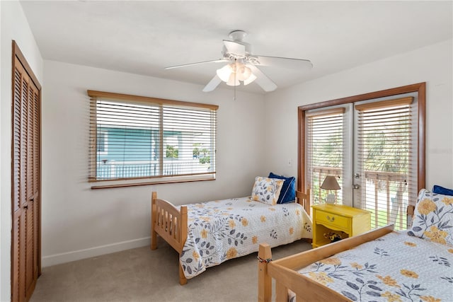 6956 Turtlemound Rd, New Smyrna Beach, FL 32169 - carpeted bedroom with access to exterior, a closet, and a ceiling fan