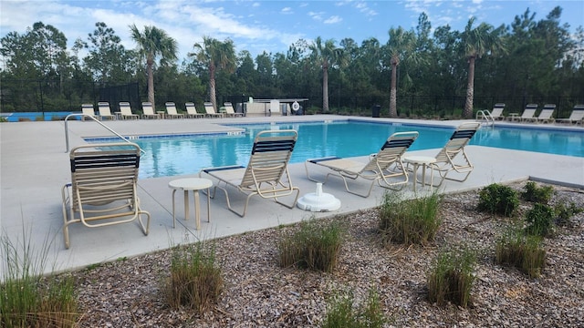 3103 Nova Scotia Way, New Smyrna Beach, FL 32168 - community pool featuring view of wooded area and a patio area