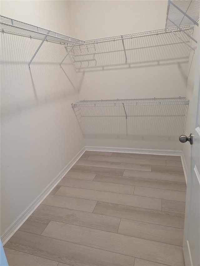 3103 Nova Scotia Way, New Smyrna Beach, FL 32168 - walk in closet with wood finished floors