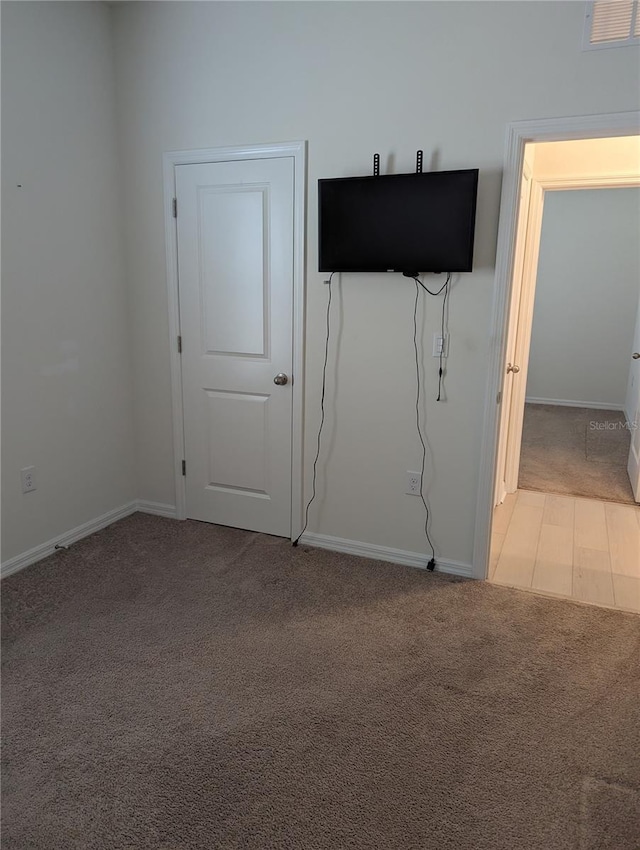 3103 Nova Scotia Way, New Smyrna Beach, FL 32168 - spare room featuring light colored carpet and baseboards