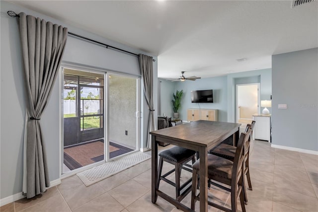2731 Neverland Dr, New Smyrna Beach, FL 32168 - dining area featuring light tile patterned flooring and a ceiling fan