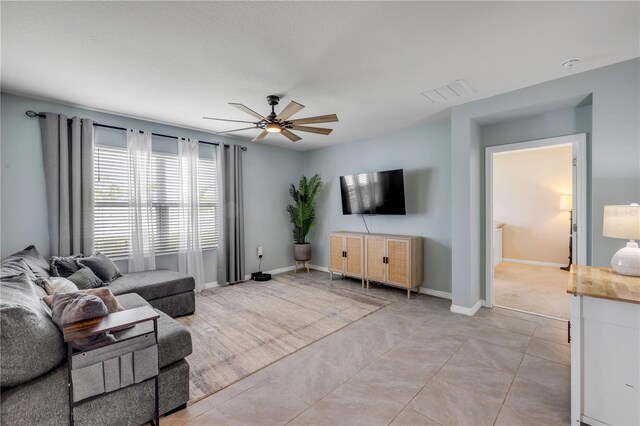 2731 Neverland Dr, New Smyrna Beach, FL 32168 - living room with ceiling fan and baseboards
