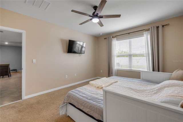 2731 Neverland Dr, New Smyrna Beach, FL 32168 - bedroom featuring light carpet and ceiling fan