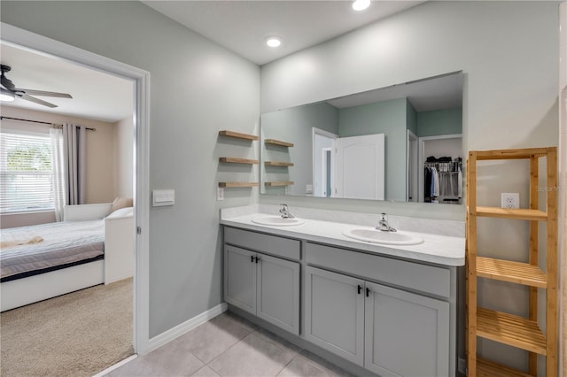 2731 Neverland Dr, New Smyrna Beach, FL 32168 - bathroom with double vanity, ensuite bath, ceiling fan, and tile patterned floors