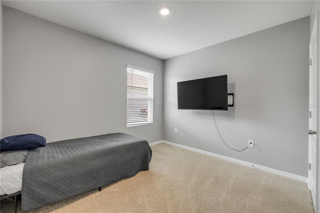 2731 Neverland Dr, New Smyrna Beach, FL 32168 - carpeted bedroom with baseboards