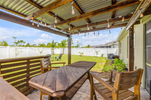 2731 Neverland Dr, New Smyrna Beach, FL 32168 - fenced backyard with outdoor dining area
