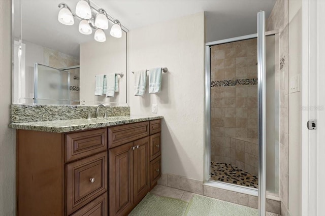 901 S Atlantic Ave Unit 202, Ormond Beach, FL 32176 - full bath with tile patterned floors, a shower stall, and vanity