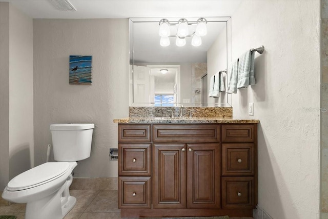 901 S Atlantic Ave Unit 202, Ormond Beach, FL 32176 - bathroom featuring vanity, tile patterned flooring, and a shower