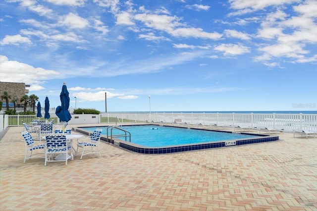 901 S Atlantic Ave Unit 202, Ormond Beach, FL 32176 - community pool featuring a patio
