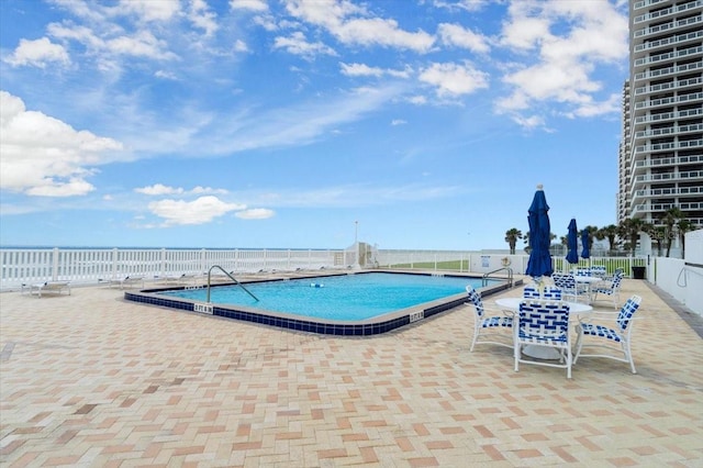 901 S Atlantic Ave Unit 202, Ormond Beach, FL 32176 - community pool featuring a patio area
