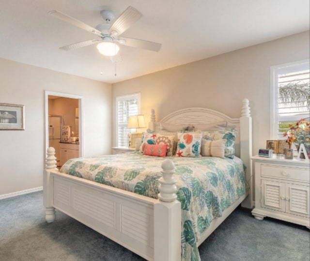 2672 Star Coral Ln, New Smyrna Beach, FL 32168 - carpeted bedroom featuring ensuite bath and a ceiling fan