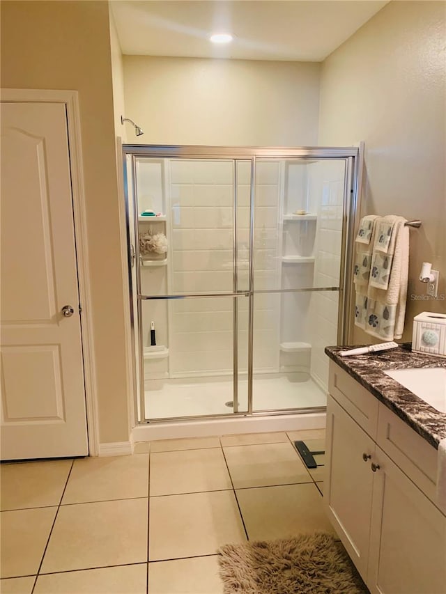 2672 Star Coral Ln, New Smyrna Beach, FL 32168 - full bathroom with a shower stall, tile patterned flooring, and vanity