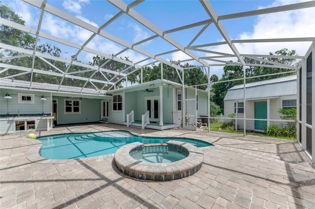 2360 Mooneyham Dr, New Smyrna Beach, FL 32168 - view of swimming pool with ceiling fan, a patio, french doors, a pool with connected hot tub, and glass enclosure