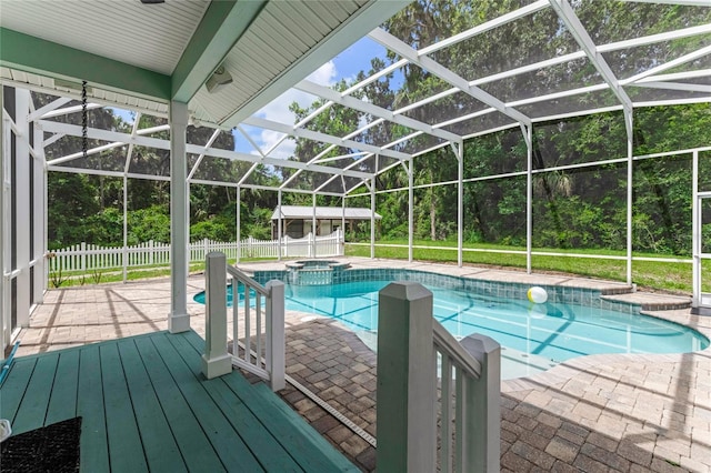 2360 Mooneyham Dr, New Smyrna Beach, FL 32168 - view of pool with a patio, a pool with connected hot tub, and view of wooded area