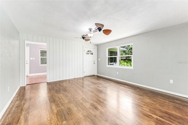 2360 Mooneyham Dr, New Smyrna Beach, FL 32168 - spare room featuring wood finished floors, a ceiling fan, and a textured ceiling