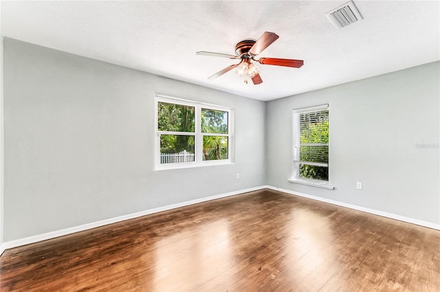 2360 Mooneyham Dr, New Smyrna Beach, FL 32168 - empty room featuring wood finished floors and a ceiling fan