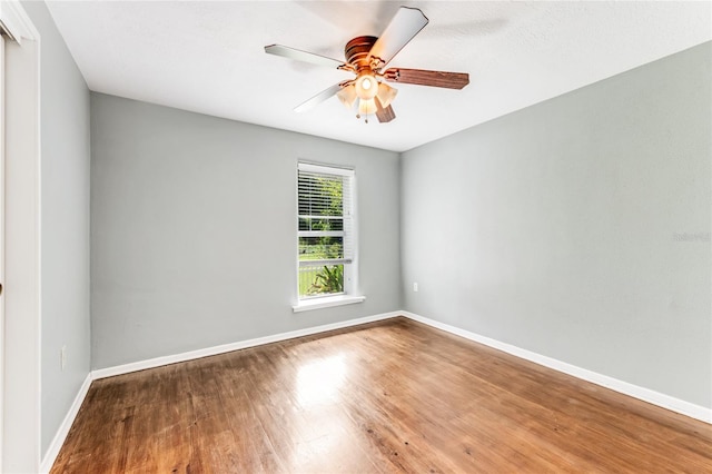 2360 Mooneyham Dr, New Smyrna Beach, FL 32168 - unfurnished room with wood finished floors and a ceiling fan