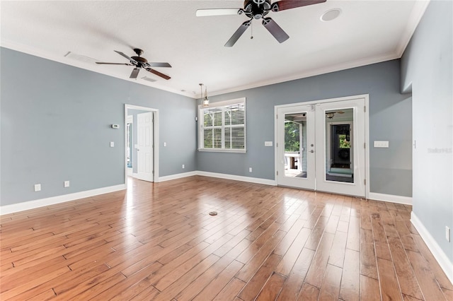 2360 Mooneyham Dr, New Smyrna Beach, FL 32168 - unfurnished room with a ceiling fan, light wood-style floors, and crown molding