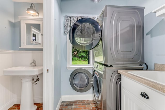 2360 Mooneyham Dr, New Smyrna Beach, FL 32168 - washroom with stacked washer / drying machine and brick floors