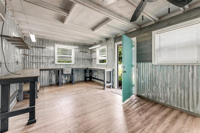 2360 Mooneyham Dr, New Smyrna Beach, FL 32168 - kitchen with wood finished floors, beamed ceiling, and wooden walls