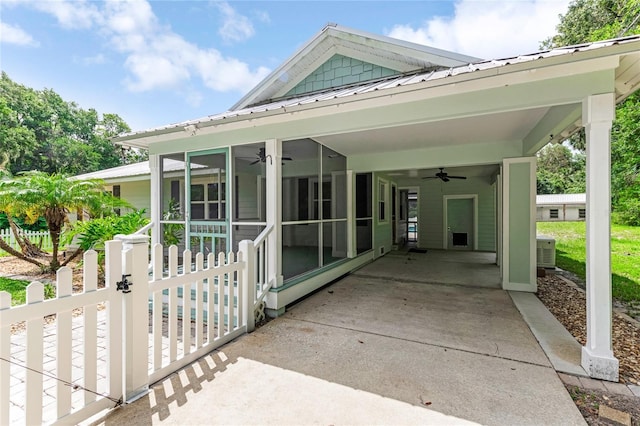 2360 Mooneyham Dr, New Smyrna Beach, FL 32168 - view of patio with ceiling fan, a sunroom, a carport, and driveway