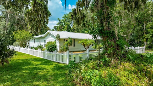 2360 Mooneyham Dr, New Smyrna Beach, FL 32168 - view of side of property featuring a metal roof