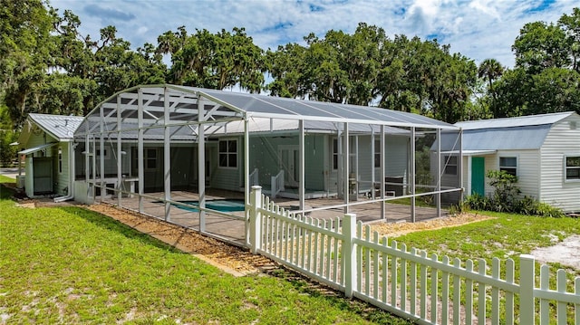 2360 Mooneyham Dr, New Smyrna Beach, FL 32168 - rear view of property with a patio area, an outdoor pool, and a lanai