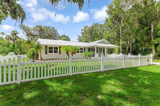 2360 Mooneyham Dr, New Smyrna Beach, FL 32168 - ranch-style home featuring a sunroom and a metal roof