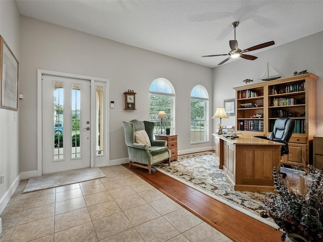 461 Luna Bella Ln, New Smyrna Beach, FL 32168 - office with a ceiling fan, light tile patterned flooring, and a textured ceiling