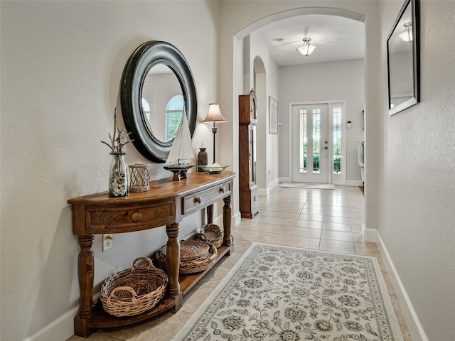 461 Luna Bella Ln, New Smyrna Beach, FL 32168 - entryway featuring arched walkways and light tile patterned floors