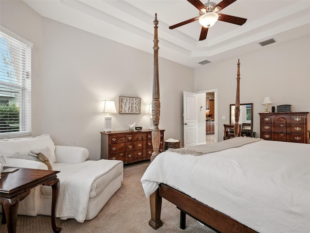 461 Luna Bella Ln, New Smyrna Beach, FL 32168 - bedroom featuring light colored carpet, a raised ceiling, and a ceiling fan