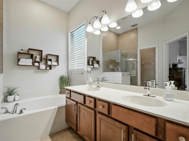 461 Luna Bella Ln, New Smyrna Beach, FL 32168 - bathroom with a shower stall, double vanity, a garden tub, tile patterned flooring, and a chandelier