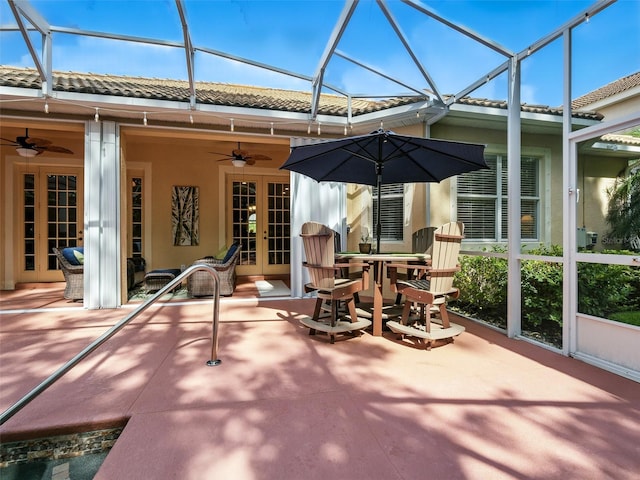 461 Luna Bella Ln, New Smyrna Beach, FL 32168 - view of patio / terrace featuring french doors, ceiling fan, a lanai, and outdoor dining area