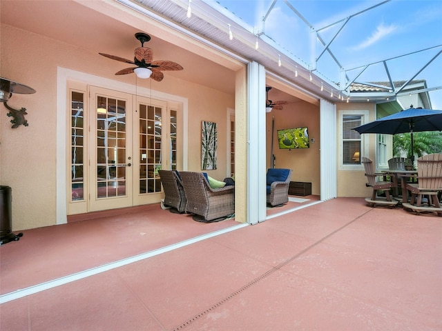 461 Luna Bella Ln, New Smyrna Beach, FL 32168 - view of patio with ceiling fan, french doors, glass enclosure, and an outdoor hangout area