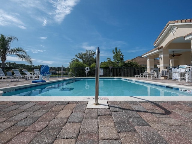 461 Luna Bella Ln, New Smyrna Beach, FL 32168 - community pool with ceiling fan and a patio area