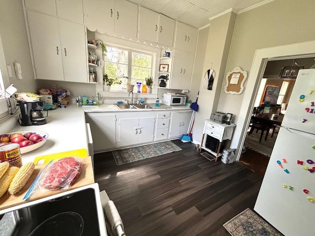 306 Murray St, New Smyrna Beach, FL 32168 - kitchen featuring white appliances, light countertops, white cabinets, dark wood finished floors, and open shelves