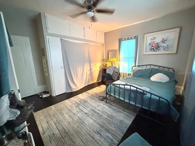 306 Murray St, New Smyrna Beach, FL 32168 - bedroom featuring wood finished floors, a closet, and a ceiling fan