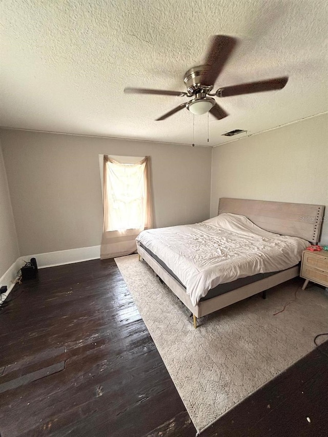 306 Murray St, New Smyrna Beach, FL 32168 - bedroom with a textured ceiling, wood finished floors, and ceiling fan