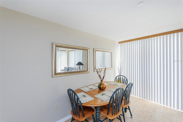 1 Oceans W Blvd Unit 1B5, Daytona Beach, FL 32118 - dining area featuring wood finished floors and baseboards
