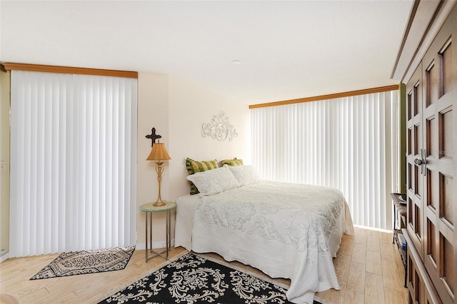 1 Oceans W Blvd Unit 1B5, Daytona Beach, FL 32118 - bedroom with light wood finished floors