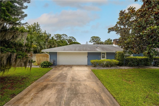 38 Fairway Cir, New Smyrna Beach, FL 32168 - view of front of property featuring an attached garage and concrete driveway