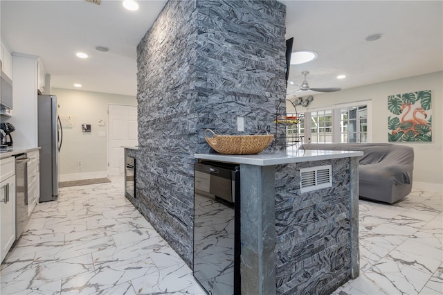 38 Fairway Cir, New Smyrna Beach, FL 32168 - detailed view of stainless steel appliances, recessed lighting, and ceiling fan