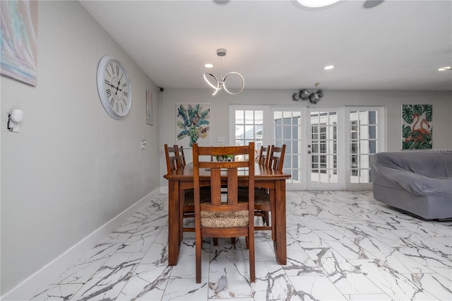 38 Fairway Cir, New Smyrna Beach, FL 32168 - dining space featuring light marble finish flooring, recessed lighting, and a chandelier