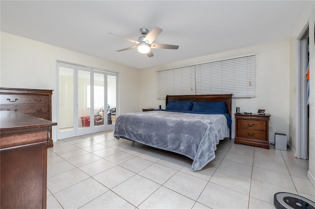 38 Fairway Cir, New Smyrna Beach, FL 32168 - bedroom featuring light tile patterned floors, access to outside, a ceiling fan, and french doors