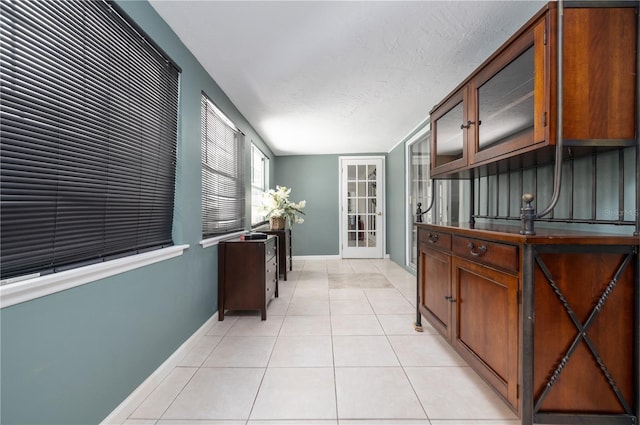 38 Fairway Cir, New Smyrna Beach, FL 32168 - hallway featuring light tile patterned floors and baseboards
