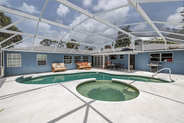 38 Fairway Cir, New Smyrna Beach, FL 32168 - view of swimming pool featuring a patio, a pool with connected hot tub, a lanai, and area for grilling