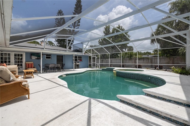 38 Fairway Cir, New Smyrna Beach, FL 32168 - view of swimming pool with a patio, an in-ground hot tub, and a fenced backyard