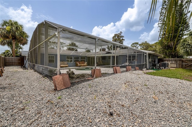 38 Fairway Cir, New Smyrna Beach, FL 32168 - rear view of house with a fenced backyard, a patio, and a lanai
