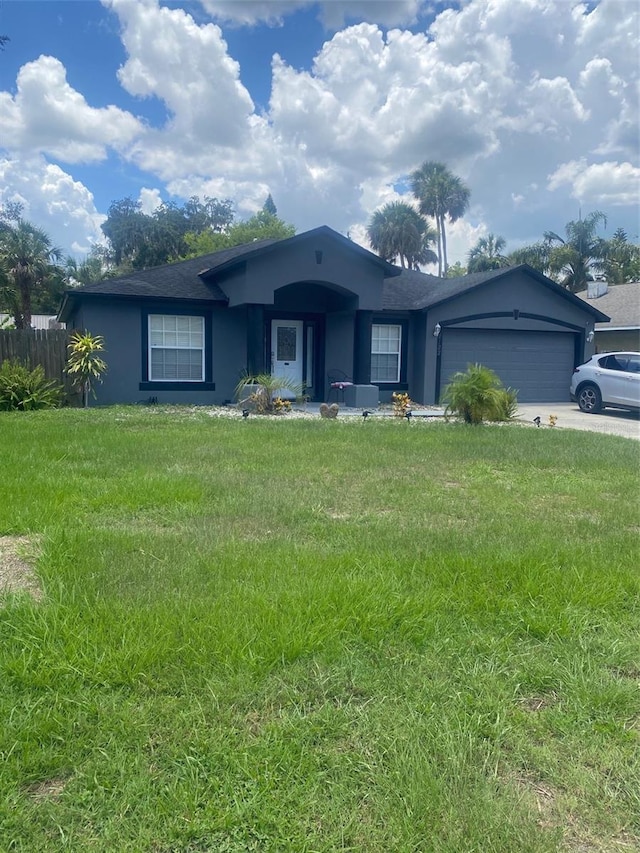 2122 Orange Tree Dr, Edgewater, FL 32141 - ranch-style home featuring stucco siding, an attached garage, and concrete driveway